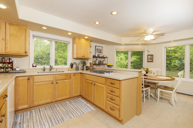 24 N Peak Vlg, Newbury, NH 03255 - kitchen with a sink, a peninsula, light tile patterned floors, light brown cabinetry, and white gas stovetop