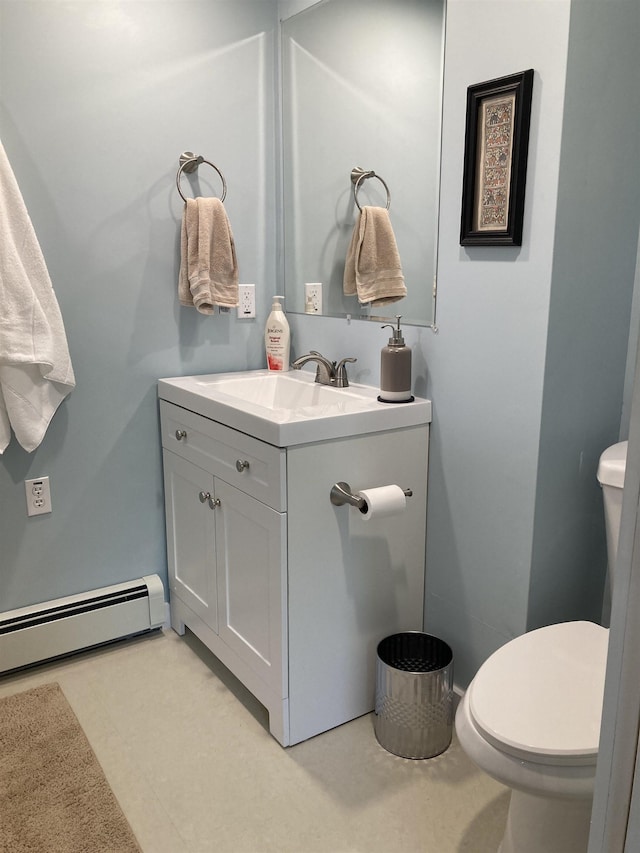 261 Vt 15 E Rd, Hyde Park, VT 05655 - bathroom with vanity, baseboard heating, and toilet