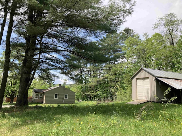 261 Vt 15 E Rd, Hyde Park, VT 05655 - view of yard with an outbuilding and a garage