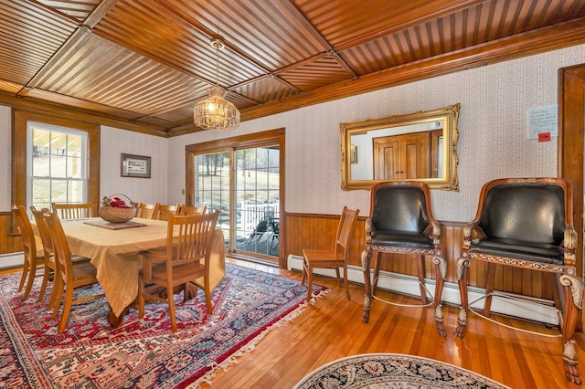 959 Presidential Hwy, Jefferson, NH 03583 - dining space with plenty of natural light, wainscoting, wood-type flooring, ornamental molding, and wood ceiling