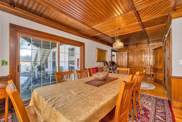 959 Presidential Hwy, Jefferson, NH 03583 - dining space with light wood-type flooring, wooden ceiling, wallpapered walls, healthy amount of natural light, and ornamental molding