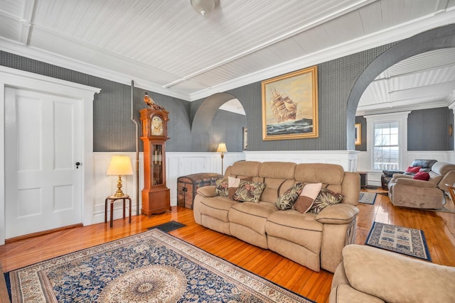 959 Presidential Hwy, Jefferson, NH 03583 - living area featuring arched walkways, wood-type flooring, ornamental molding, wainscoting, and a decorative wall