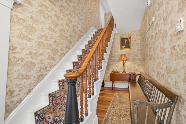 959 Presidential Hwy, Jefferson, NH 03583 - staircase with wallpapered walls and wood finished floors