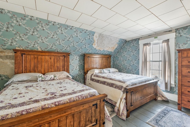 959 Presidential Hwy, Jefferson, NH 03583 - bedroom with wallpapered walls and hardwood / wood-style flooring