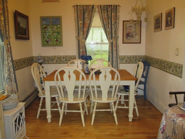 1996 Main St, Bethlehem, NH 03574 - dining space featuring wood finished floors and a baseboard radiator