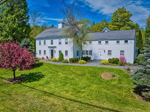499 Andover Rd, New London, NH 03257 - view of front facade featuring a chimney and a front yard