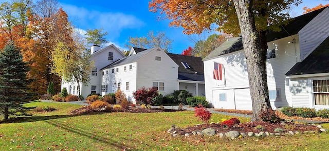 499 Andover Rd, New London, NH 03257 - view of side of home featuring a lawn