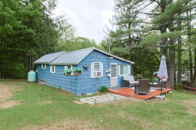 26 Neal Shore Rd, Meredith, NH 03253 - back of house with a deck, a lawn, cooling unit, and metal roof