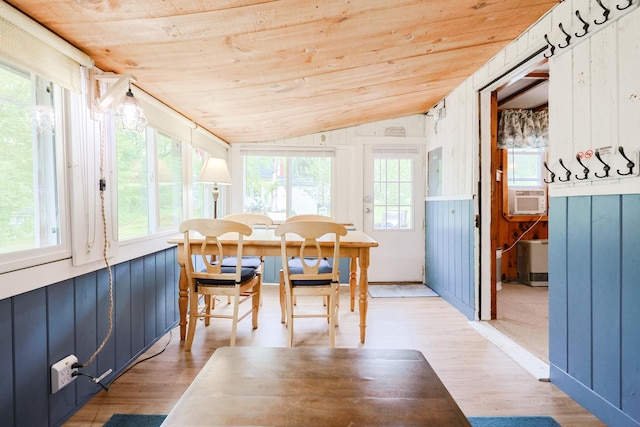 26 Neal Shore Rd, Meredith, NH 03253 - dining space with vaulted ceiling, wood ceiling, healthy amount of natural light, light wood finished floors, and cooling unit