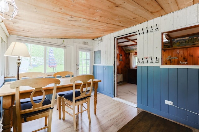 26 Neal Shore Rd, Meredith, NH 03253 - dining space featuring light wood finished floors, wooden ceiling, electric panel, and wood walls