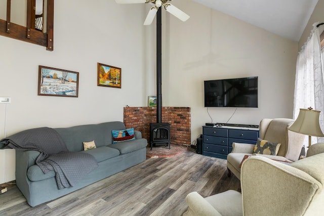 21 Pleasant Dr, Grantham, NH 03753 - living room with high vaulted ceiling, a wood stove, wood finished floors, and ceiling fan