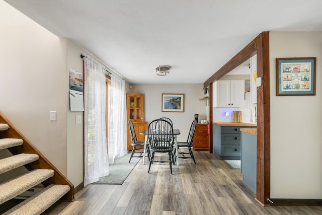 21 Pleasant Dr, Grantham, NH 03753 - dining area featuring wood finished floors, stairs, and baseboards
