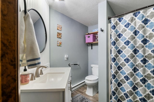 21 Pleasant Dr, Grantham, NH 03753 - full bathroom featuring wood finished floors, a baseboard heating unit, a textured ceiling, vanity, and toilet