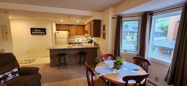 73 Alpine Dr Unit C211, Killington, VT 05751 - dining space featuring electric panel, plenty of natural light, light colored carpet, recessed lighting, and a baseboard radiator