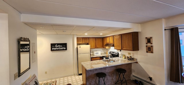 73 Alpine Dr Unit C211, Killington, VT 05751 - kitchen featuring white appliances, a peninsula, light floors, a breakfast bar area, and light stone countertops