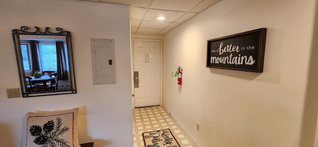 73 Alpine Dr Unit C211, Killington, VT 05751 - hall with electric panel, tile patterned floors, a paneled ceiling, and baseboards