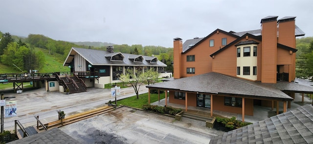 73 Alpine Dr Unit C211, Killington, VT 05751 - back of property with stairway and a shingled roof