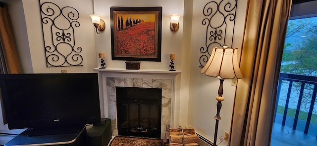 73 Alpine Dr Unit C211, Killington, VT 05751 - detailed view of a tile fireplace, baseboard heating, and a baseboard heating unit