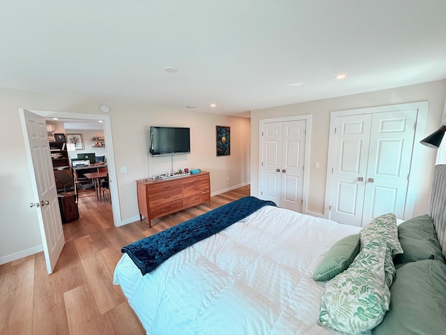 2366 Mountain Rd Unit 3, Stowe, VT 05672 - bedroom featuring multiple closets, light wood-type flooring, baseboards, recessed lighting, and an office area
