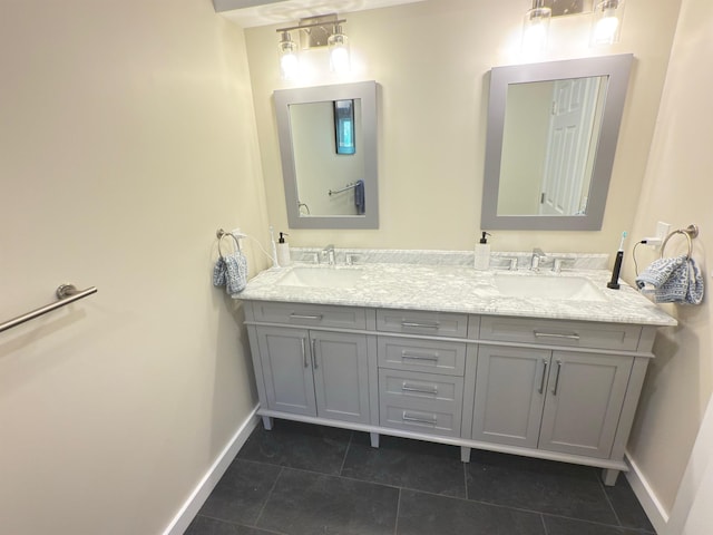 2366 Mountain Rd Unit 3, Stowe, VT 05672 - bathroom with double vanity, baseboards, and tile patterned flooring