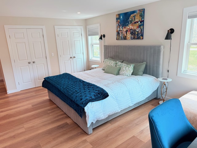 2366 Mountain Rd Unit 3, Stowe, VT 05672 - bedroom with wood finished floors, multiple closets, recessed lighting, and baseboards