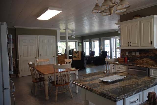 57 Farrants Pt, Newport City, VT 05855 - kitchen with dishwasher, white cabinetry, crown molding, plenty of natural light, and a chandelier
