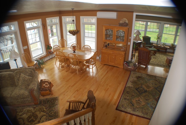 57 Farrants Pt, Newport City, VT 05855 - dining space with an AC wall unit and light wood-style floors