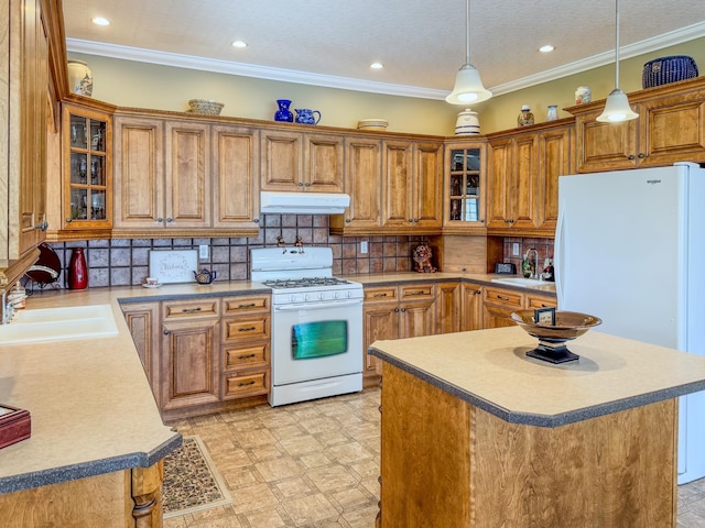 57 Farrants Pt, Newport City, VT 05855 - kitchen featuring white appliances, under cabinet range hood, brown cabinets, a sink, and recessed lighting