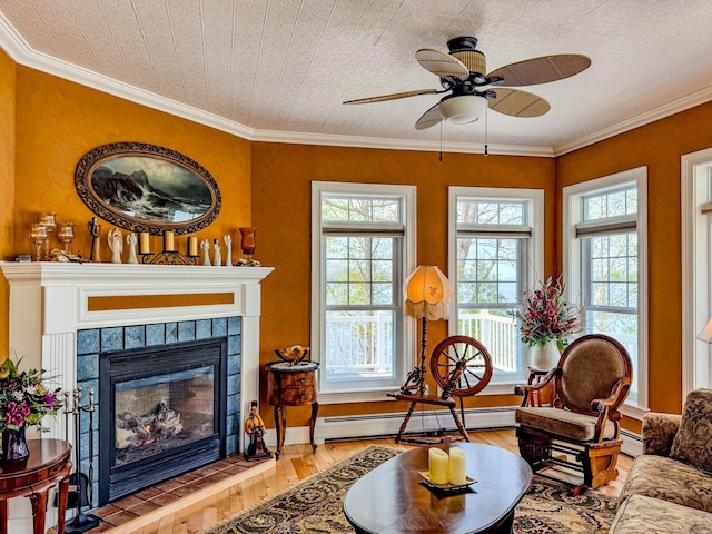 57 Farrants Pt, Newport City, VT 05855 - living area with plenty of natural light, light wood finished floors, ceiling fan, a baseboard heating unit, and crown molding