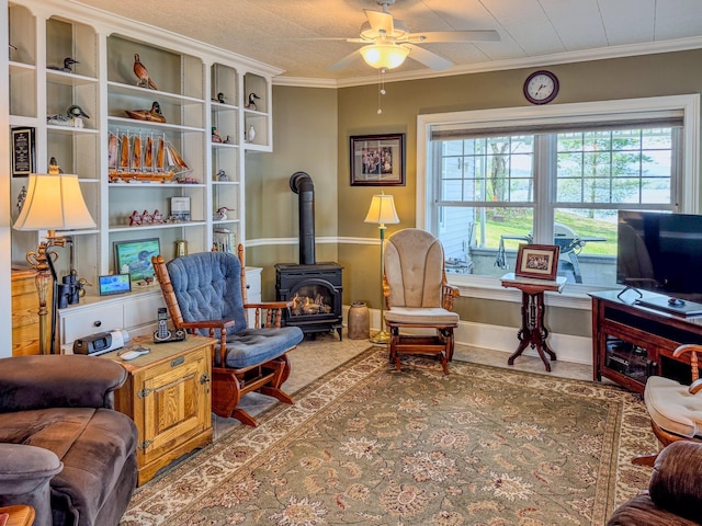 57 Farrants Pt, Newport City, VT 05855 - living room featuring a wood stove, a ceiling fan, crown molding, and baseboards
