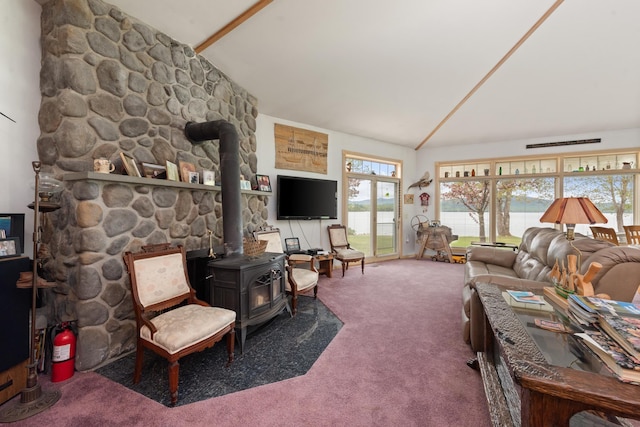 1 Mayhew Tpke, Bridgewater, NH 03222 - carpeted living area with a wood stove