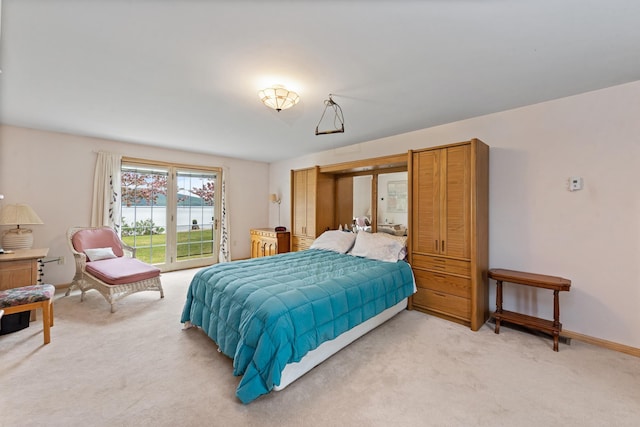 1 Mayhew Tpke, Bridgewater, NH 03222 - bedroom with access to exterior, light carpet, and baseboards