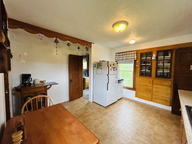 6998 River Rd, Lemington, VT 05903 - dining space with a textured ceiling and baseboards
