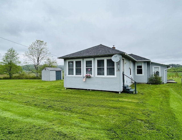 6998 River Rd, Lemington, VT 05903 - back of house with a lawn, entry steps, and roof with shingles