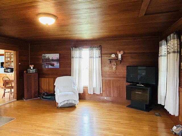 6998 River Rd, Lemington, VT 05903 - living area featuring wooden ceiling, wood finished floors, and wood walls