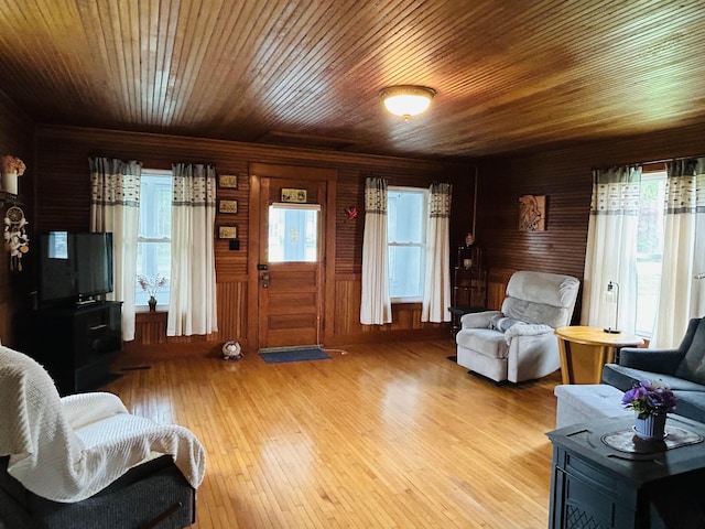6998 River Rd, Lemington, VT 05903 - living area with light wood-style flooring, wood walls, and wooden ceiling