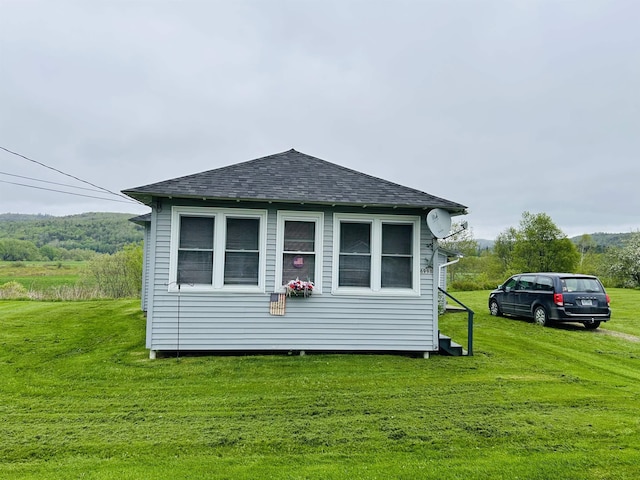 6998 River Rd, Lemington, VT 05903 - view of property exterior featuring roof with shingles and a yard