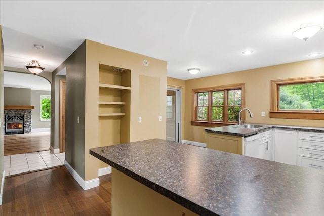 379 Swallow Hill Rd, Pownal, VT 05261 - kitchen featuring a sink, dishwasher, white cabinetry, dark countertops, and healthy amount of natural light