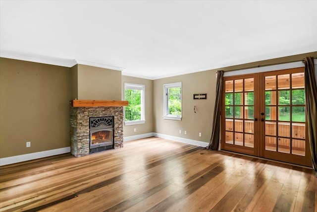 379 Swallow Hill Rd, Pownal, VT 05261 - unfurnished living room featuring french doors, baseboards, hardwood / wood-style floors, ornamental molding, and a fireplace