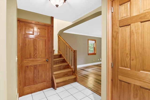 379 Swallow Hill Rd, Pownal, VT 05261 - stairway with tile patterned floors, crown molding, and baseboards