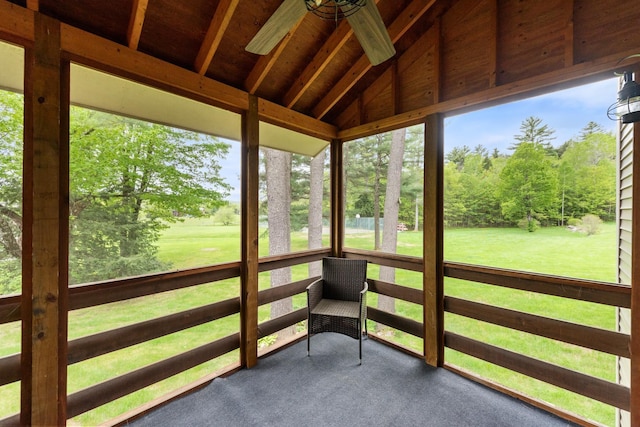 11 Village W Dr Unit 5, Bristol, NH 03222 - sunroom / solarium with lofted ceiling, healthy amount of natural light, view of scattered trees, and a ceiling fan