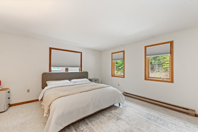 11 Village W Dr Unit 5, Bristol, NH 03222 - bedroom with a baseboard heating unit, baseboards, and light colored carpet