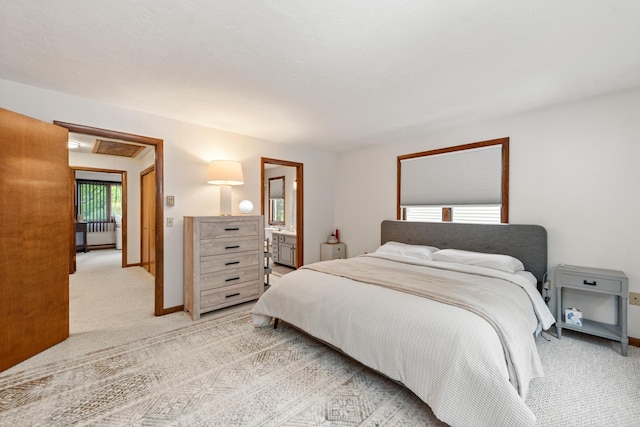 11 Village W Dr Unit 5, Bristol, NH 03222 - bedroom with light colored carpet, baseboards, and connected bathroom