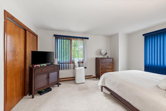 11 Village W Dr Unit 5, Bristol, NH 03222 - bedroom with light colored carpet, a baseboard radiator, and a closet