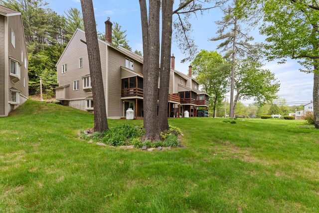 11 Village W Dr Unit 5, Bristol, NH 03222 - view of grassy yard with a deck