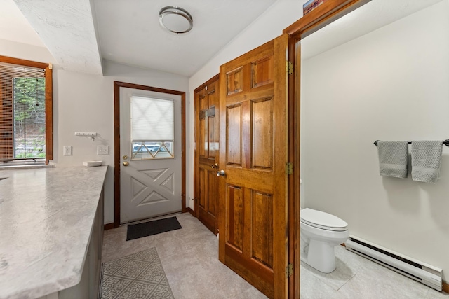 11 Village W Dr Unit 5, Bristol, NH 03222 - bathroom featuring a baseboard heating unit, toilet, and lofted ceiling