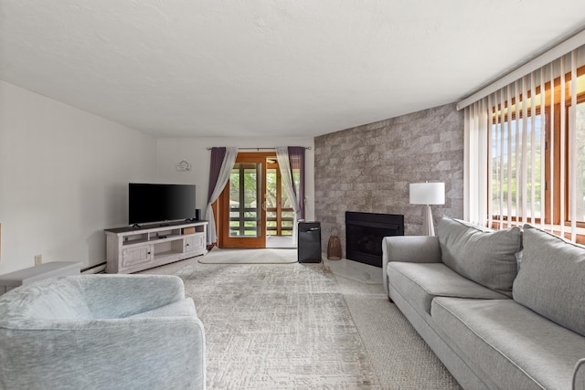 11 Village W Dr Unit 5, Bristol, NH 03222 - carpeted living area featuring plenty of natural light and a large fireplace