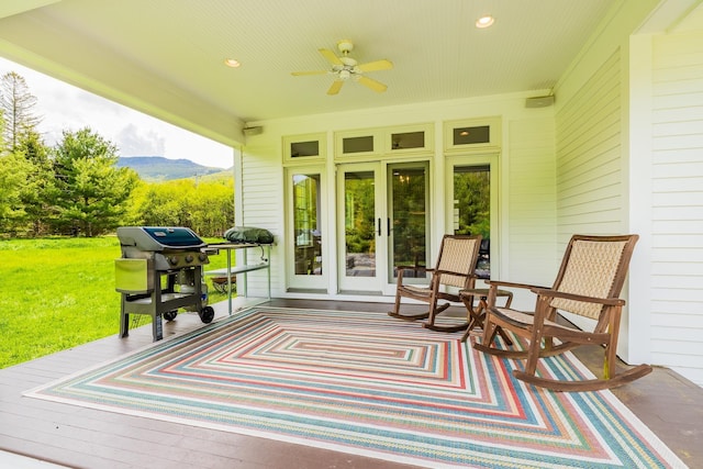 543 Lower Hollow Rd, Dorset, VT 05251 - deck with ceiling fan, a mountain view, area for grilling, and a lawn