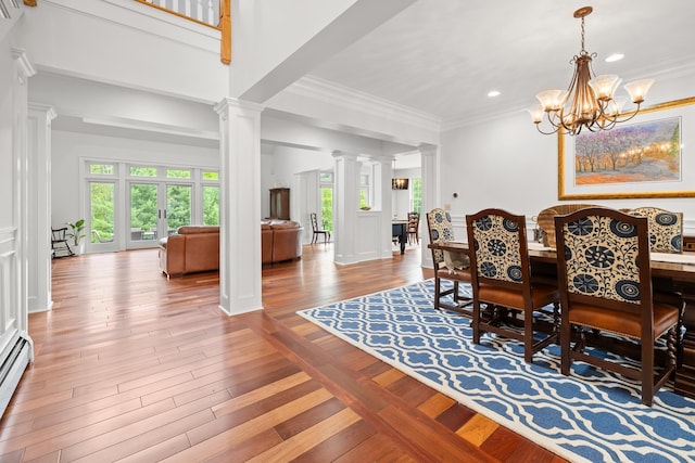 543 Lower Hollow Rd, Dorset, VT 05251 - dining area featuring decorative columns, a chandelier, crown molding, recessed lighting, and wood finished floors