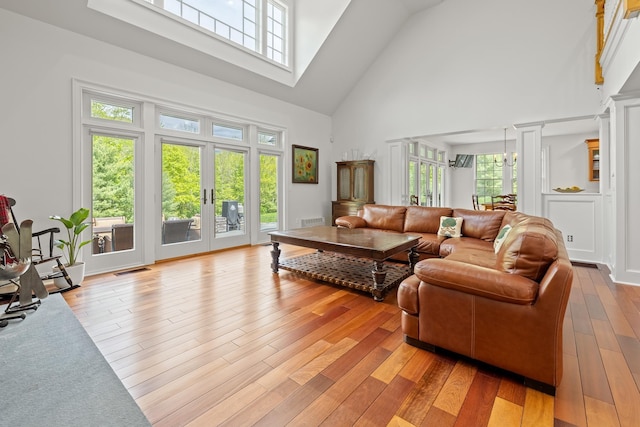 543 Lower Hollow Rd, Dorset, VT 05251 - living area with high vaulted ceiling, french doors, and light wood finished floors
